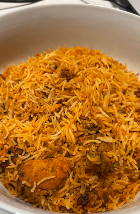 Slow-cooked chicken dum biryani in the pot